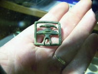 july knee buckle in hand for size 1.JPG.png
