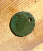 Holed coin bust.jpg