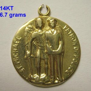 Nice chunk of gold.  Back is engraved with initials and date