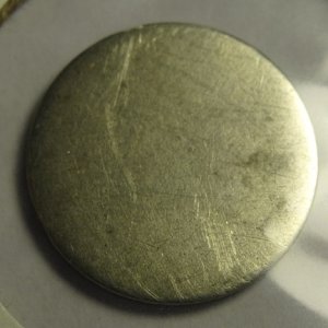 Shaved down reverse side of 1858 half dime.