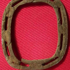An "open work" styled  knee buckle frame , along the frame are leaf motif stamping .