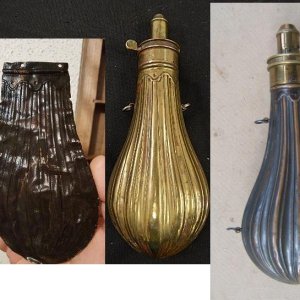 Copper powder flask (half) circa. 1850-60's made by the American Flask & Cap Co.  

also in the picture are a couple of examples of what the flask may