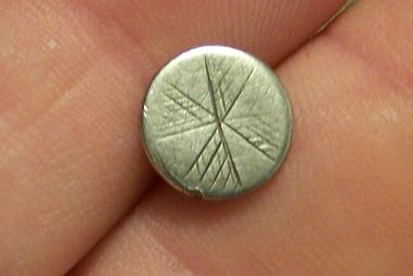 colonial silver cufflink with handtooled flower motif